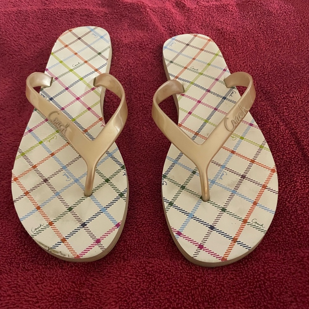 Gold and cream coach flip flops. Gently worn. Great condition. Size 9B.